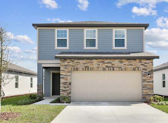 a blue house with a white garage door