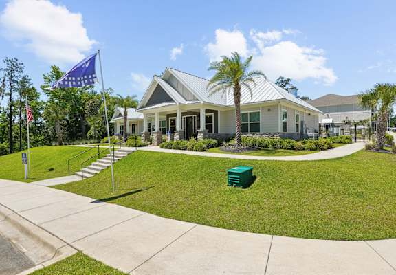 The front of the leasing office with Westdale flag at Capital Grand Apartments in Tallahassee, FL