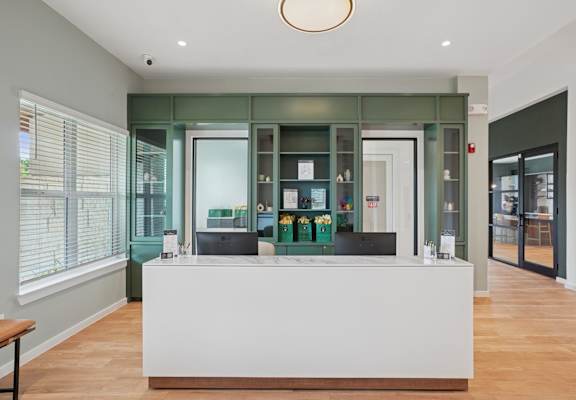 A leasing office with a reception area at Hillside on Parmer Lane Apartments in Austin, TX