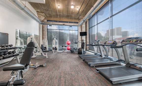 free weights and cardio machines in the gym at the central apartments near downtown minneapolis mn