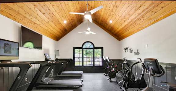 a gym with treadmills and elliptical machines at Columbus Apartments in Columbus, Georgia, GA