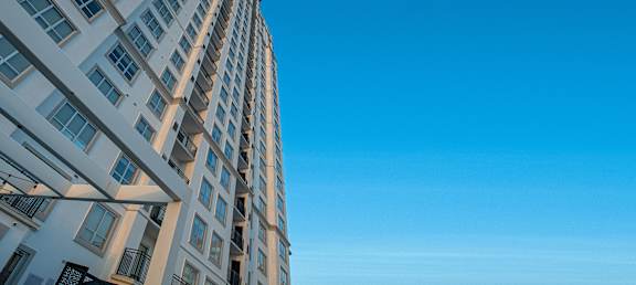 a tall building with a blue sky in the background