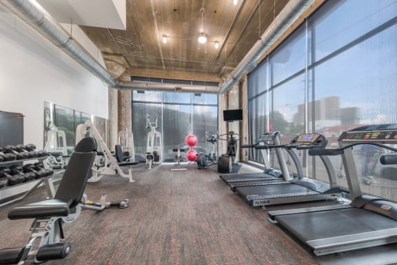 free weights and cardio machines in the gym at the central apartments near downtown minneapolis mn