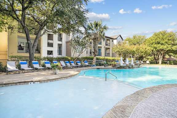 Shallow end of sparkling pool at Southwestern Medical Park Apartments in Dallas, TX