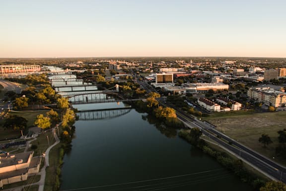 A cityscape with a river running through it.