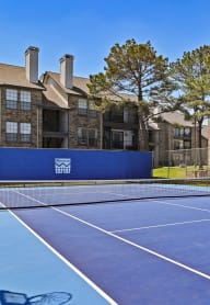 Blue Tennis Court at Camino Del Sol Apartment Homes in Denton, Texas, TX