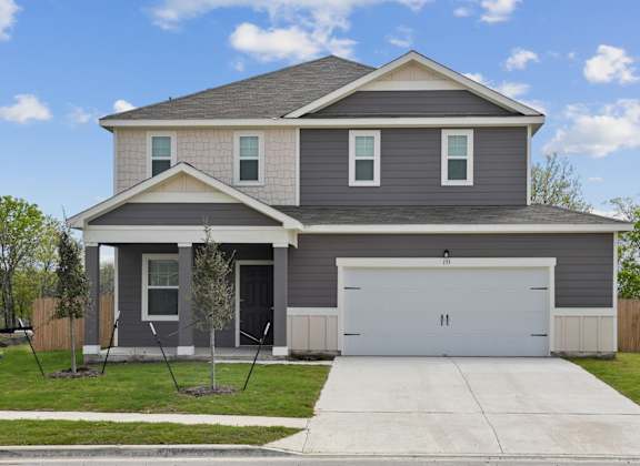 a house with a white garage door at Beacon at Bunton Creek, Kyle, TX