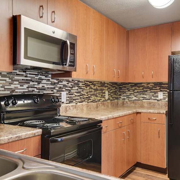 Unit Kitchen at On The Green Apartments in Austin, Texas, TX