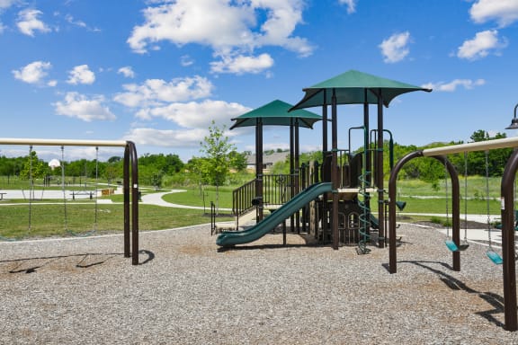 a playground with a slide and monkey bars