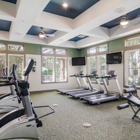 Fitness Center with cardio equipment and windows at Oakleaf Plantation in Jacksonville, FL