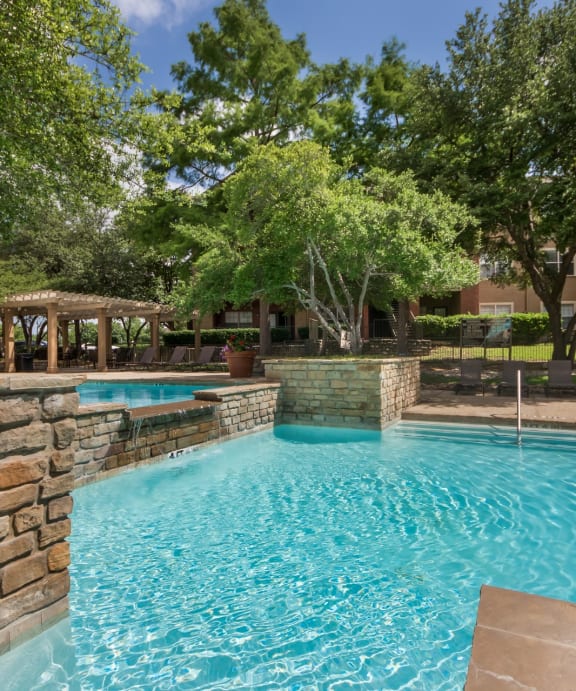 Waterfall in Pool  at Jefferson Place Apartments in Irving, Texas, TX