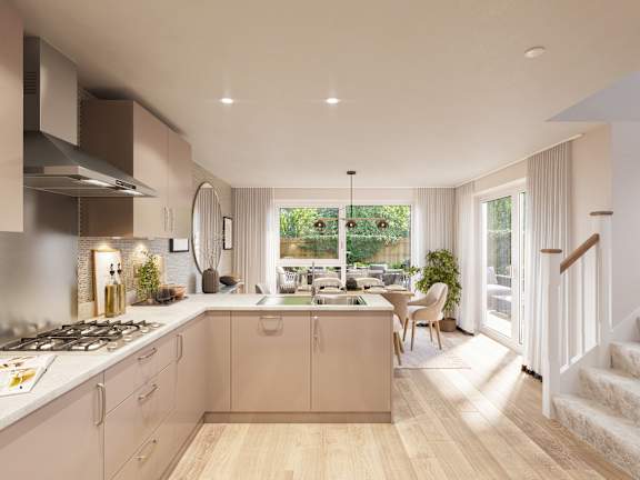 A modern kitchen with a stove top oven and a dining table.