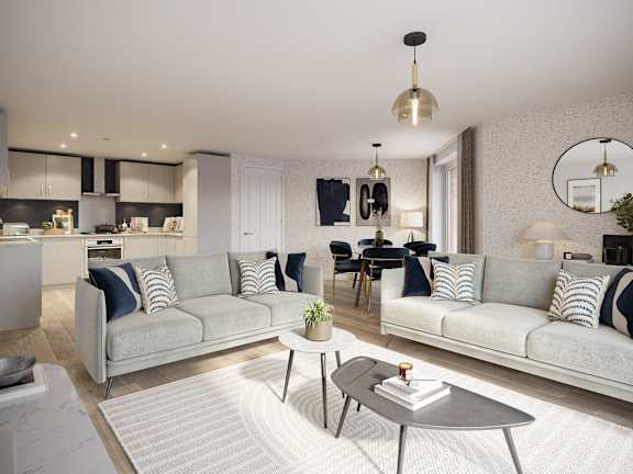 A modern living room with a grey sofa and a coffee table.