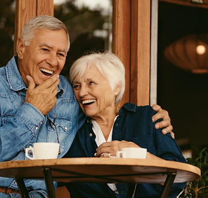 Happy couple at a cafe at TRILLIUM LANDING, JUNEAU, AK