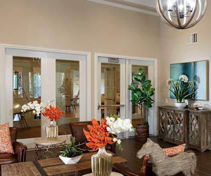 a living room with a table and chairs