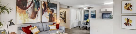 a living room with a yellow rug and a couch at Parkway at Silverado Ranch, Las Vegas