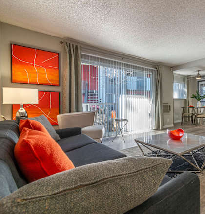 a living room with a couch and a tv at Sunnyvale Crossings Apartments, LLC, Sunnyvale California