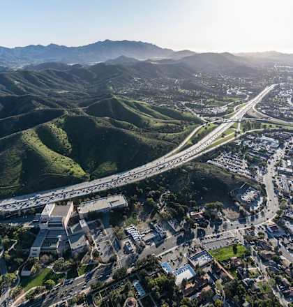 an aerial view of a city with highways and mountains at Thousand Oaks, Thousand Oaks, CA