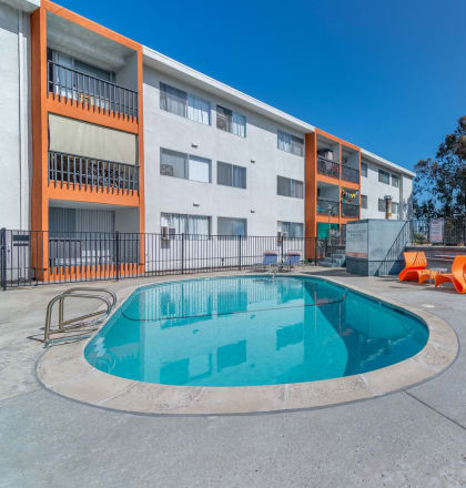 our apartments have a resort style pool and lounge chairs at Citra Apartments LLC, San Diego, California