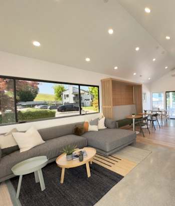 a rendering of a living room with a couch and a table at Diablo Vista Apartments, Livermore, 94551