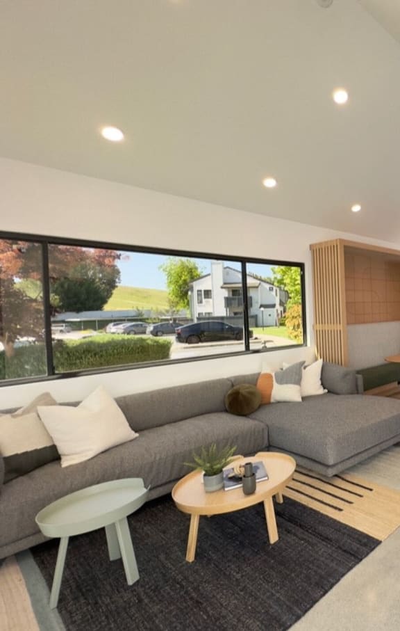 a rendering of a living room with a couch and a table at Diablo Vista Apartments, Livermore, CA, 94551