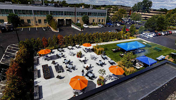 A large building with a parking lot in front of it.