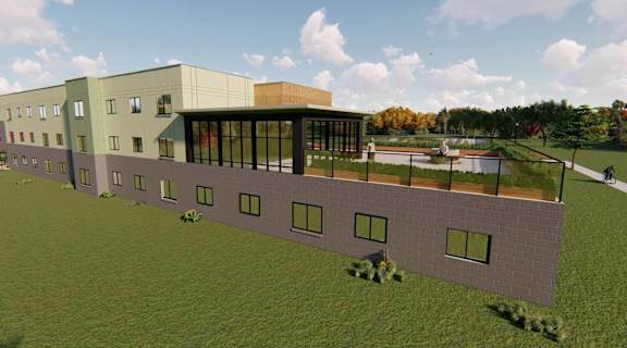 an artist rendering of a building with a green field