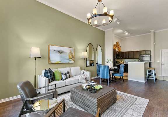 A living room with a white couch and a coffee table at Prairie Crossing, Farmers Branch
