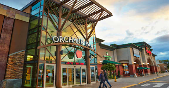 A large building with a sign that says Orchard Park.