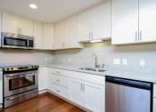 Thumbnail 11 of 15 - Harbor Hill Apartments interior kitchen