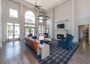 Thumbnail 5 of 14 - Swift Creek Commons Apartments - Resident clubhouse with fireplace