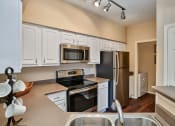 Thumbnail 14 of 18 - Grand Centennial - Spacious kitchens with ample cabinet space