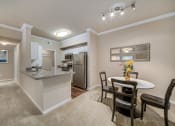 Thumbnail 16 of 18 - The Commons apartments interior living room and kitchen