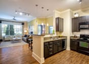 Thumbnail 15 of 18 - Parc at Grandview Apartments unit interior of living room and kitchen