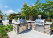 Thumbnail 4 of 18 - Glenbrook Apartments charcoal grills and picnic areas throughout