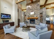 Thumbnail 6 of 18 - Glenbrook Apartments clubhouse resident lounge with fireplace and coffee bar