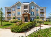 Thumbnail 9 of 18 - Glenbrook Apartments - Building exterior and pathway with stairs
