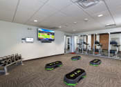 Thumbnail 8 of 12 - Fitness area with Wellbeats for The KC High Line Apartments in Kansas City, MO