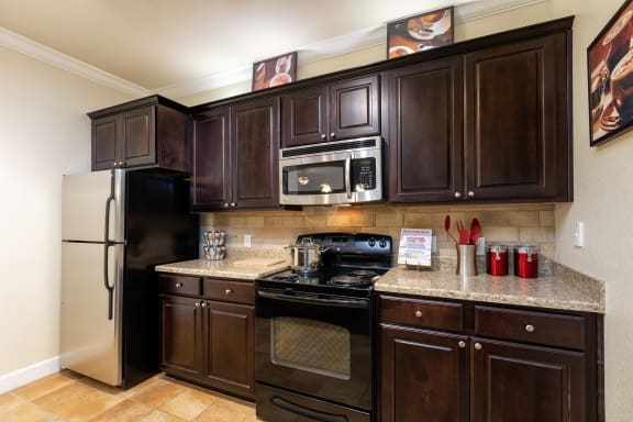 DeLayne at Twin Creeks espresso wood cabinetry