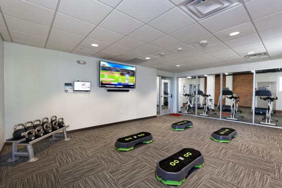 Fitness area with Wellbeats for The KC High Line Apartments in Kansas City, MO