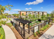 Thumbnail 6 of 12 - Nona Park Village Apartments - community garden