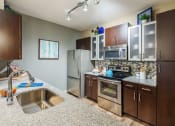 Thumbnail 11 of 12 - Nona Park Village Apartments - gourmet kitchens with granite countertops