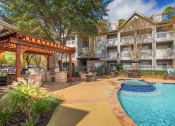 Thumbnail 10 of 18 - Lodge at Cypresswood Apartments - Spa with nearby BBQ grills