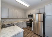 Thumbnail 11 of 14 - Swift Creek Commons Apartments - Interior kitchen with premium upgraded finishes