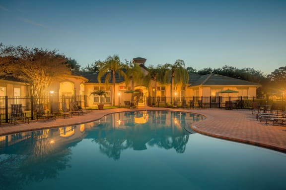 Versant Place Apartments resort-style pool at dusk