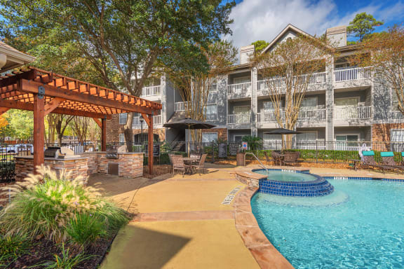Lodge at Cypresswood Apartments - Spa with nearby BBQ grills