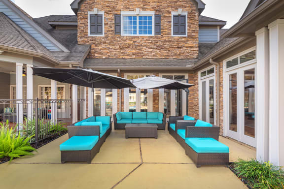 Lodge at Cypresswood Apartments - Poolside lounge
