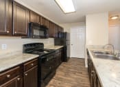 Thumbnail 10 of 14 - Swift Creek Commons Apartments - Interior kitchen with premium upgraded finishes
