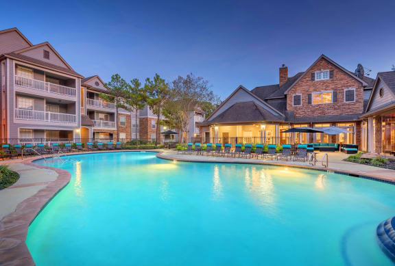 Lodge at Cypresswood Apartments - Pool with sundeck at twilight