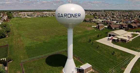 an aerial view of a water tower with the logo on it